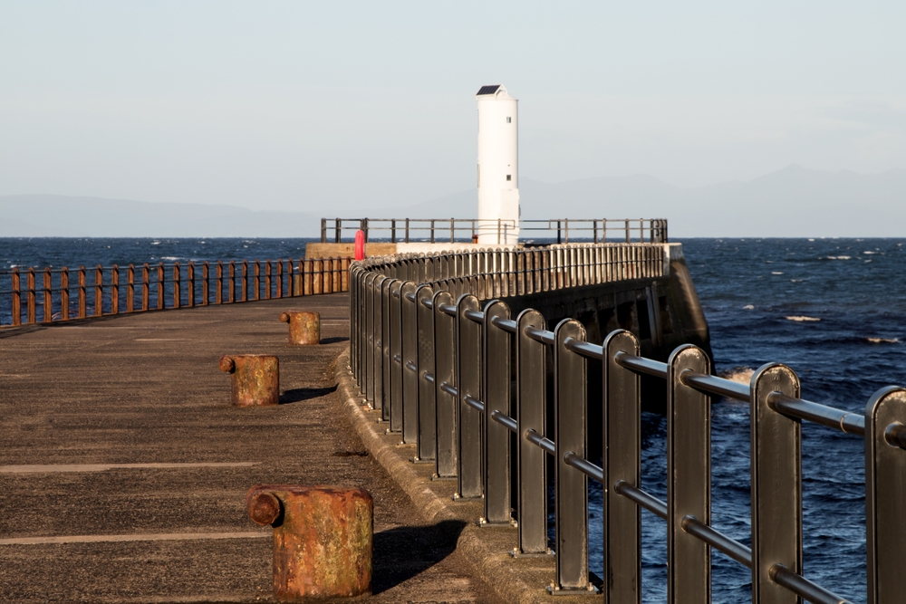 Harbour,Light,And,Jetty,At,A,Small,Port,In,Southern